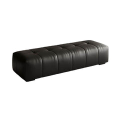 Minimalist black ottoman in a modern living room