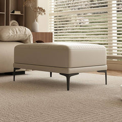 Sleek ottoman with brown metal legs