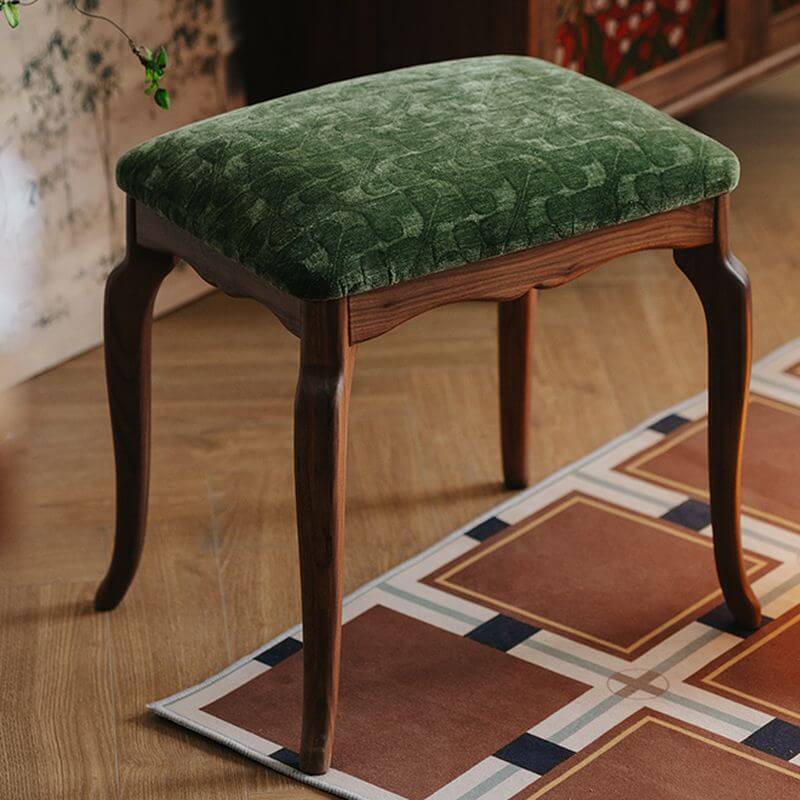 Minimalist accent stool with green upholstery