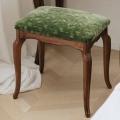 Wooden leg accent stool in living room