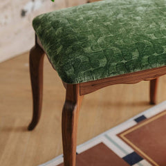 Green upholstered stool for versatile seating