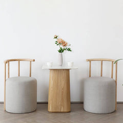 Minimalist upholstered drum stool in light gray