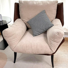 Minimalist white accent chair with removable cushions