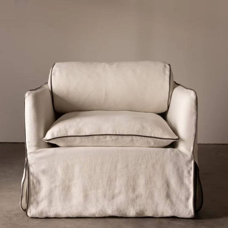 close-up of armrest on white arm chair