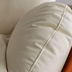 Contemporary beige swivel chair on hardwood floor