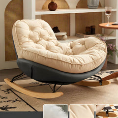 Stylish beige rocking chair placed in a cozy living room