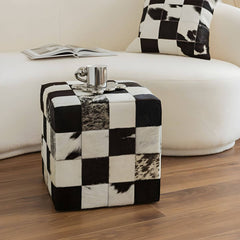 Upholstered stool with wooden frame and black plaid design