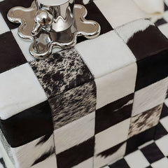 Stylish black plaid pattern on upholstered stool