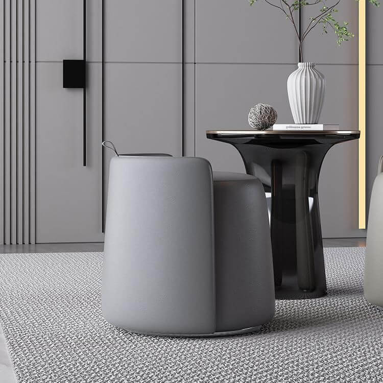 Modern faux leather pouf ottoman in black with silver legs