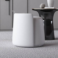 Beige pouf ottoman with silver accents for elegance