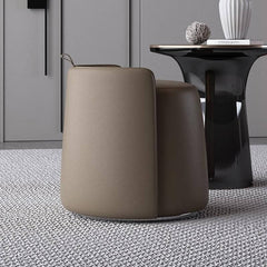 Gray faux leather pouf ottoman on a stylish carpet