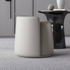 Stylish gray pouf ottoman complementing a modern setup