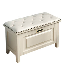 White rectangular ottoman beside a sofa