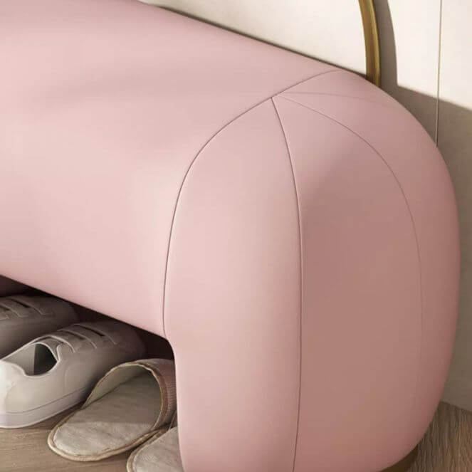 Stylish pink leather ottoman in living room