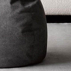 Round pouf in a minimalist setting