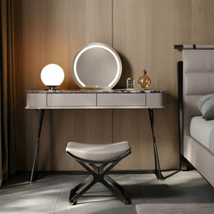 Gray vanity stool set against a stylish backdrop