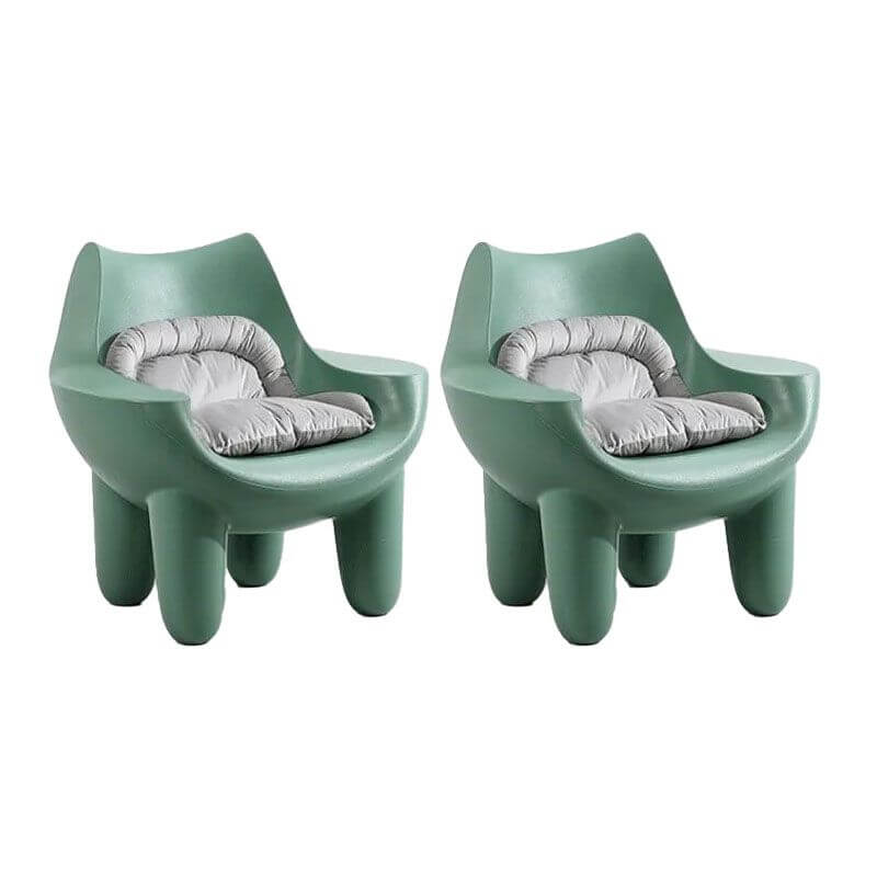 Grey cushions on solid color arm chair