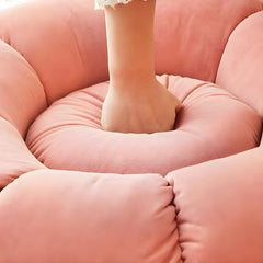 Close-up of pink upholstery on the ottoman