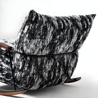 Stylish metal-framed rocking chair indoors