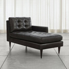 Chaise Lounge with gray upholstery and black legs