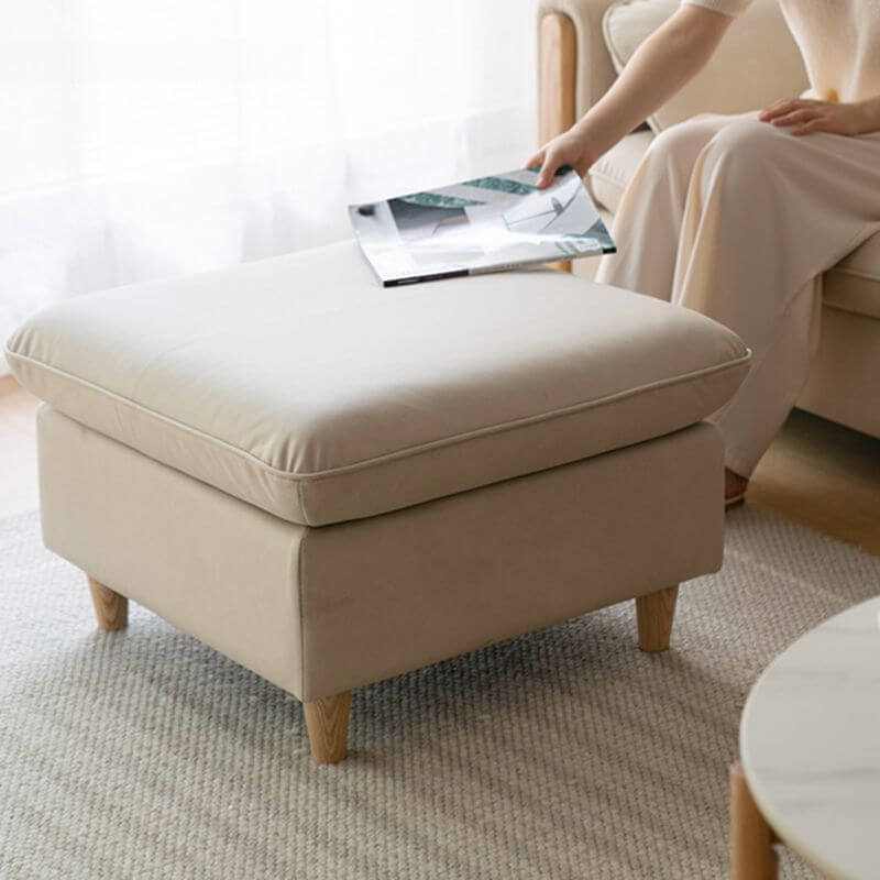 Modern beige footstool in living room