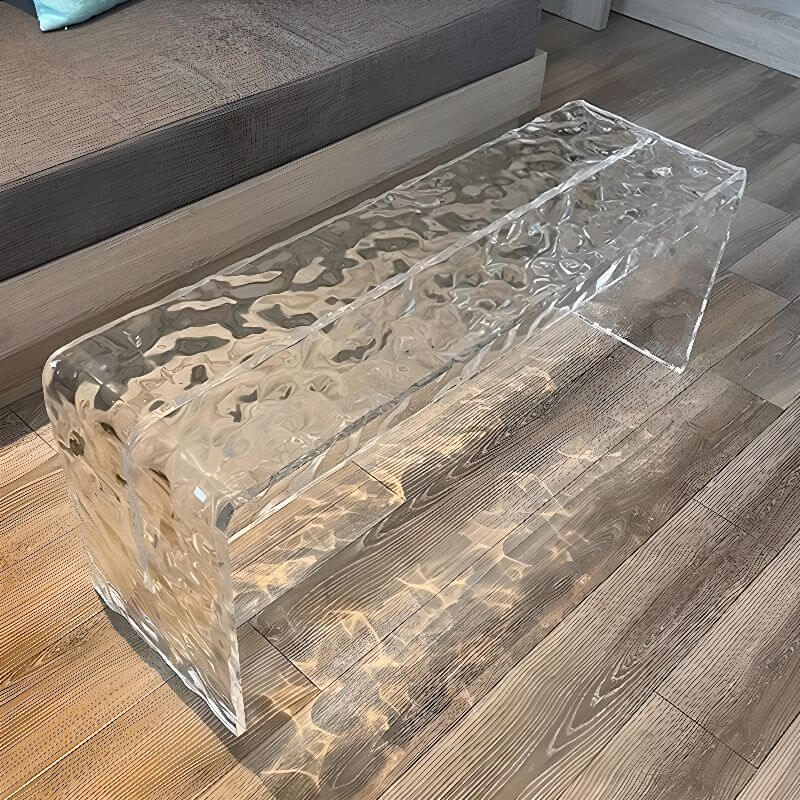 Clear acrylic accent bench in a modern bedroom