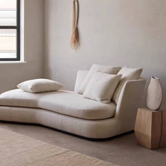 Flared arm design of white chaise lounge