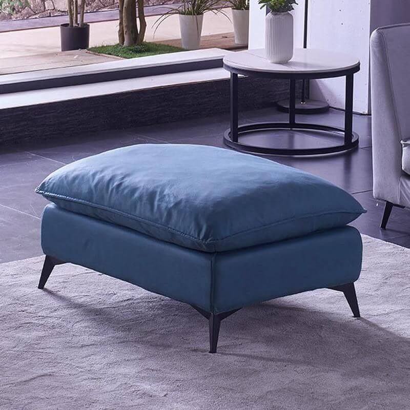 Faux leather upholstered ottoman with black legs