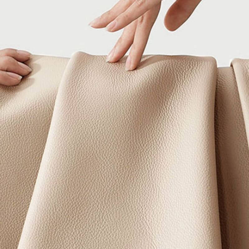 Blue upholstered stool against modern backdrop