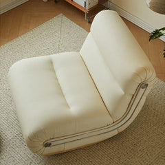 orange modern rocking chair on a wooden floor