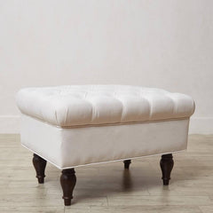 Tufted cushion on footstool