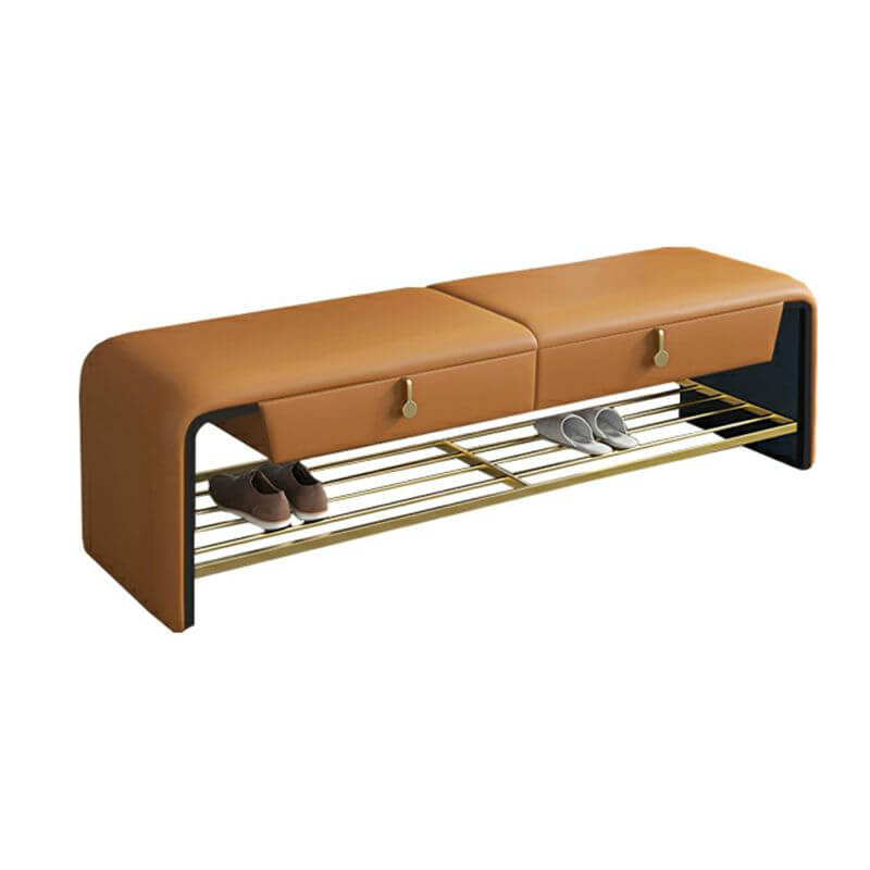 Modern gray storage ottoman placed at the foot of the bed