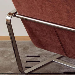 Close-up of Modish Accent Chair's sleek armrest