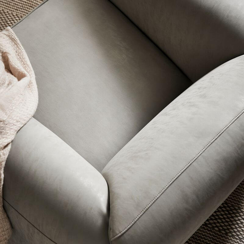 Ivory armchair showcasing soft cushion