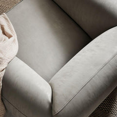 Ivory armchair showcasing soft cushion