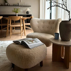 Interior design featuring modern furniture with wingback chair