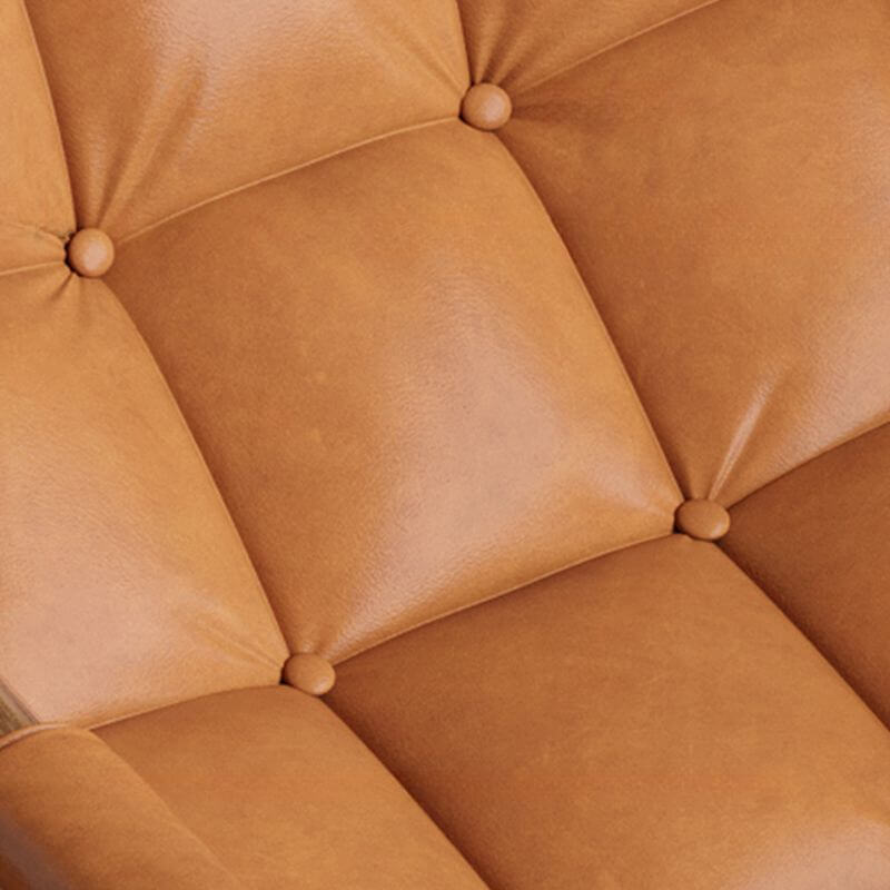 Grey rocking chair beside a bookshelf