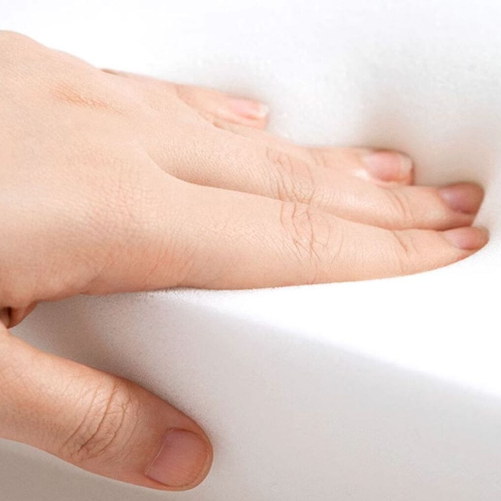 Stylish dark wood arm chair in a cozy corner