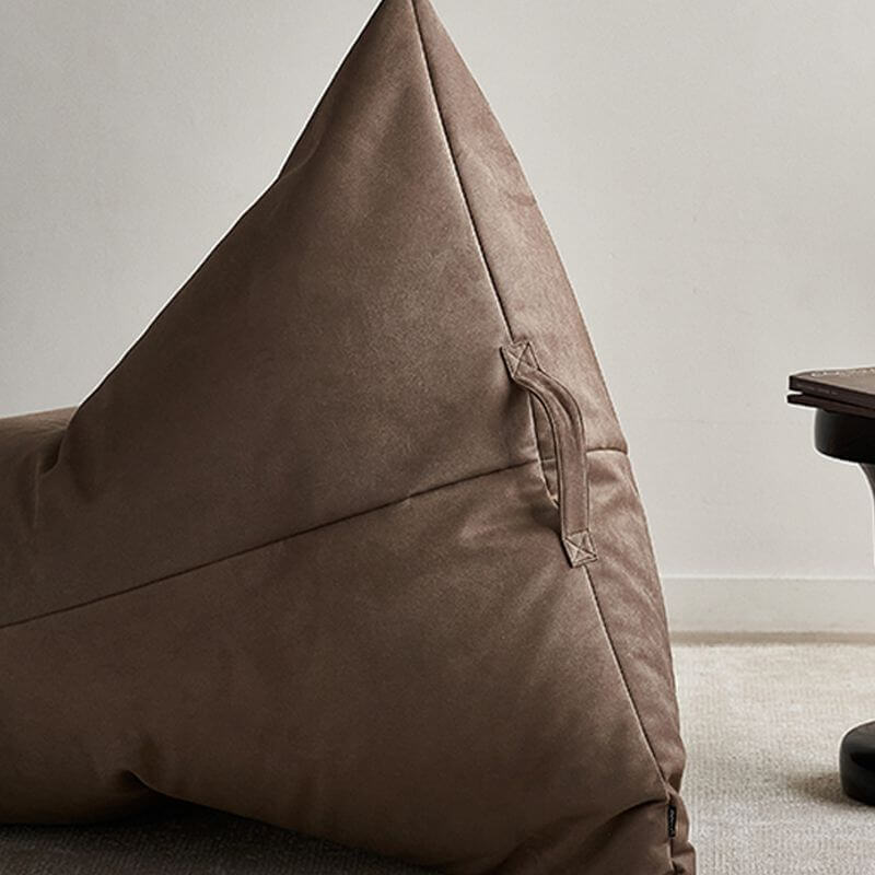 Faux leather bean bag chair in a bedroom setting