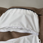 Student relaxing in oversized bean bag chair