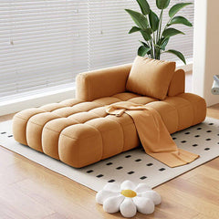 padded chaise lounge chair in beige