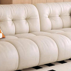 Plush pillows on modern sofa