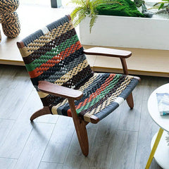 Patchwork arm chair with woven back in tropical style