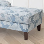 Overstuffed chaise loveseat with floral pattern