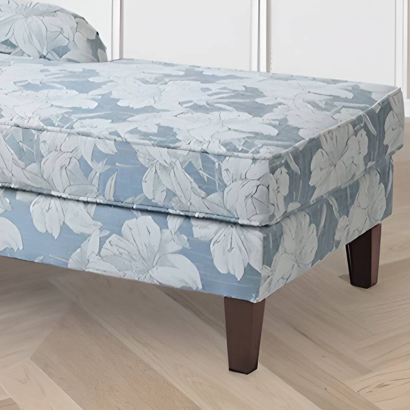 Overstuffed chaise loveseat with floral pattern