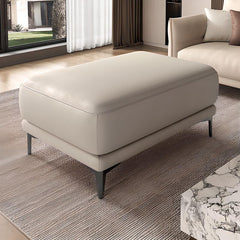 Solid color grey ottoman used as footrest