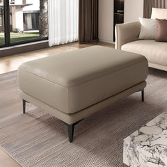 Durable faux leather ottoman in living room setting