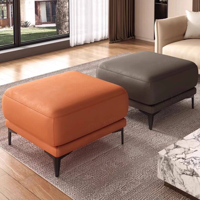 Modern leather ottoman with black metal legs