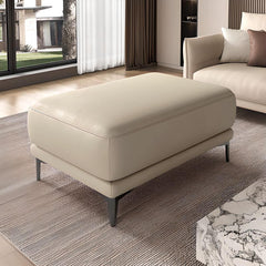 Durable faux leather ottoman in living room setting