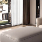 Solid color grey ottoman used as footrest